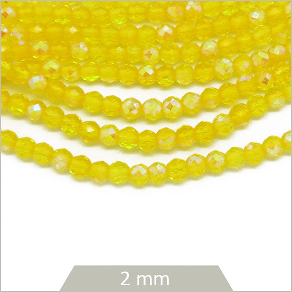 Env. 215 perles de verre à facettes 2 mm, jaune irisé