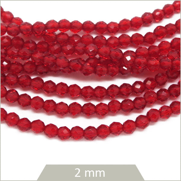 env. 180 perles de verre facettes rouge transparente 2mm