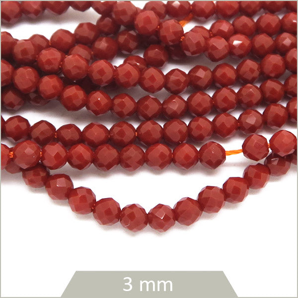 env. 129 perles de verre facettes rouge brique mat 3 mm