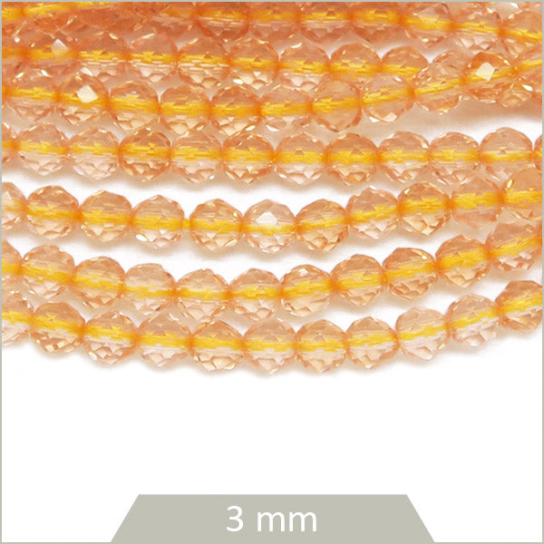 Env. 125 perles de verre à facettes champagne, 3 mm