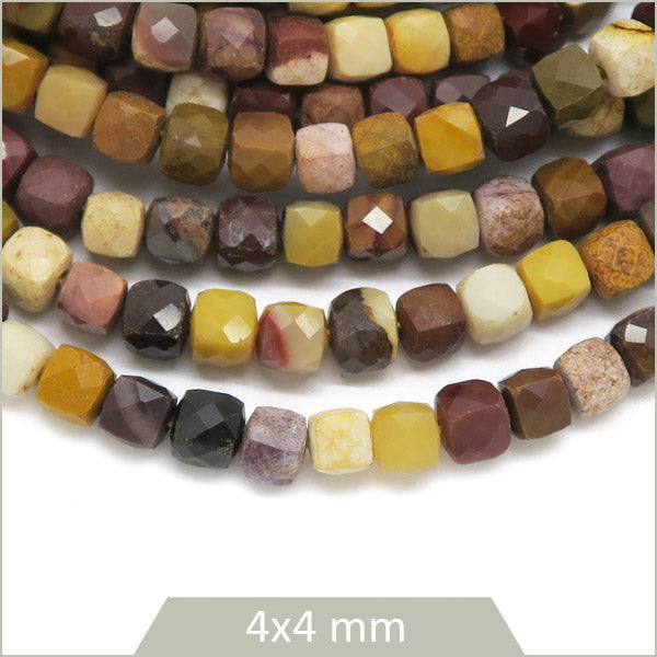 Env. 90 perles cubes facettées en Mookaïte, 4x4mm env.