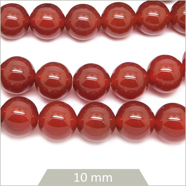 Env. 35 perles rondes en Cornaline, 10 mm