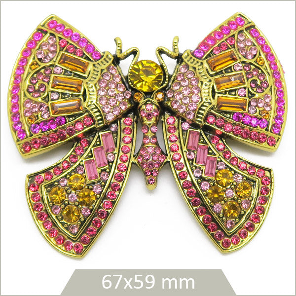 1 grande broche papillon alliage doré, strass tons roses et ambrés