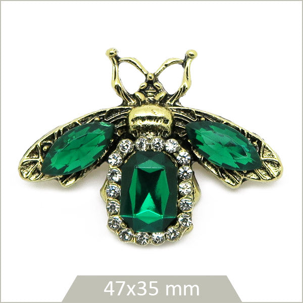 1 broche scarabée alliage doré, cristaux émeraude