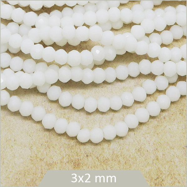 Env. 140 perles de verre à facettes donut, blanches 3x2 mm