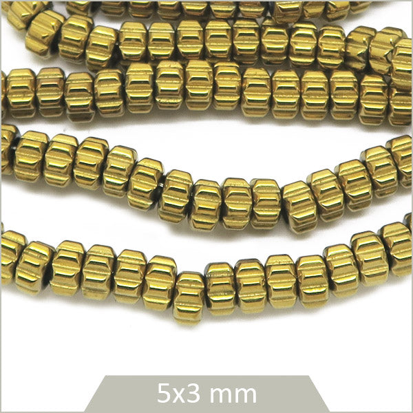 Env. 130 perles donut en hématite doré clair