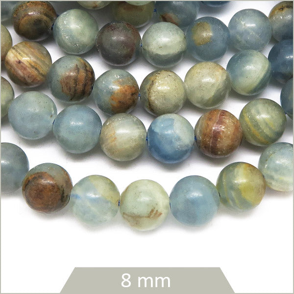 Env. 47 perles rondes en Calcite bleue 8 mm