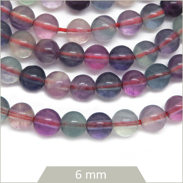 Env. 67 perles rondes en Fluorite arc-en-ciel 6 mm