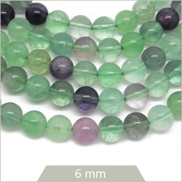 Env. 61 perles rondes en Fluorite 6 mm