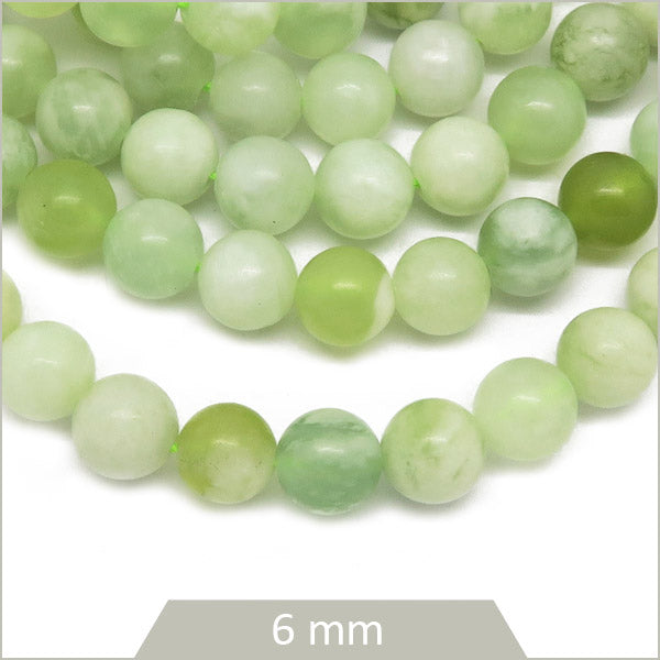 Env. 60 perles rondes en Jade fil d'or, 6 mm