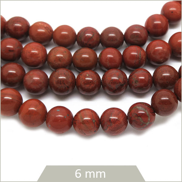Env. 59 perles rondes en Jaspe rouge 6 mm