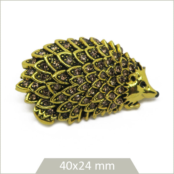 1 broche herisson alliage doré, cristaux ambrés