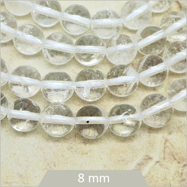 Env. 45 perles rondes en Quartz transparent 8 mm