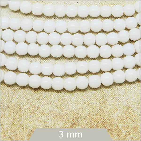 Env. 120 perles de verre rondes blanches, 3 mm