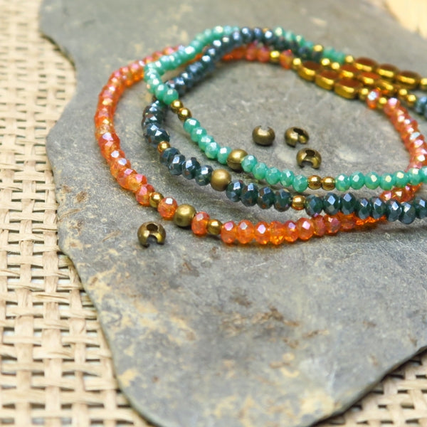 Env. 80 perles cache noeud bronze 3 mm