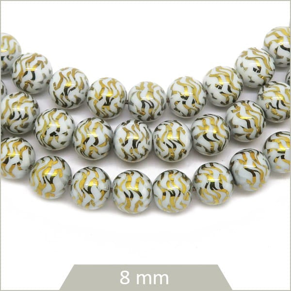 Perles rondes en verre blanc et or