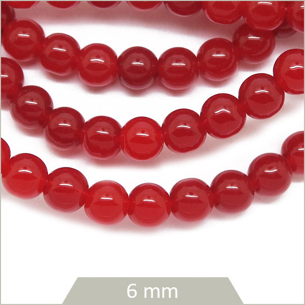 Env. 65 perles de verre rouge foncé 6 mm