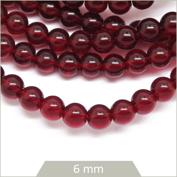 Env. 65 perles de verre rouge grenat 6 mm