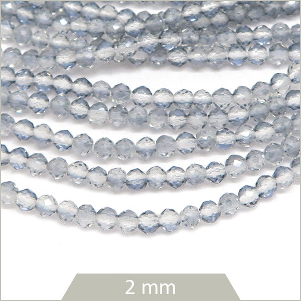 Env. 180 perles de verre à facettes grises transparentes, 2 mm