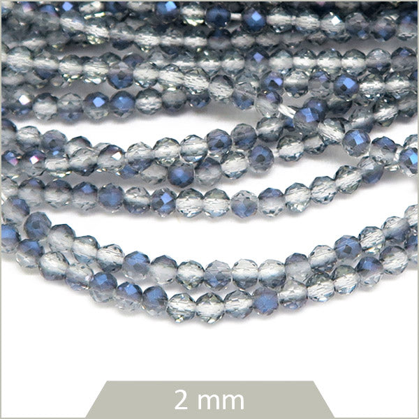 Env. 180 perles de verre à facettes grises transparentes reflets bleus, 2 mm