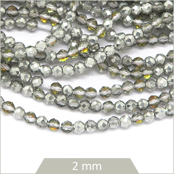 Env. 180 perles de verre à facettes argent irisé reflets dorés, 2 mm