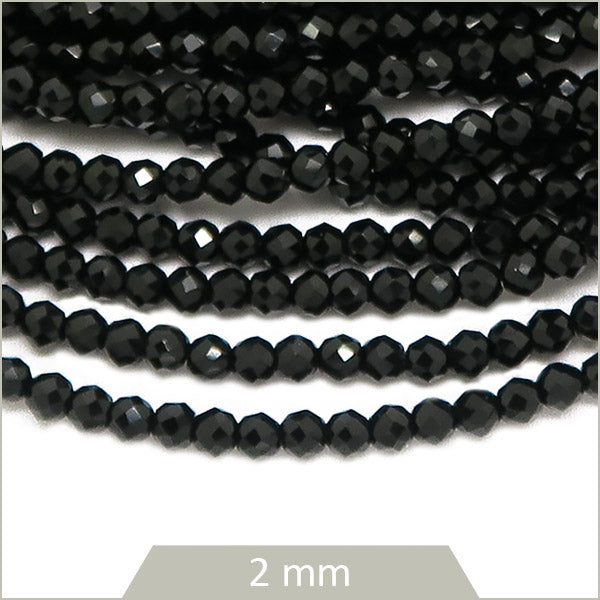 Env. 180 perles de verre à facettes noires, 2 mm