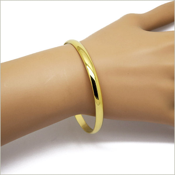1 bracelet jonc en acier doré, largeur 5 mm