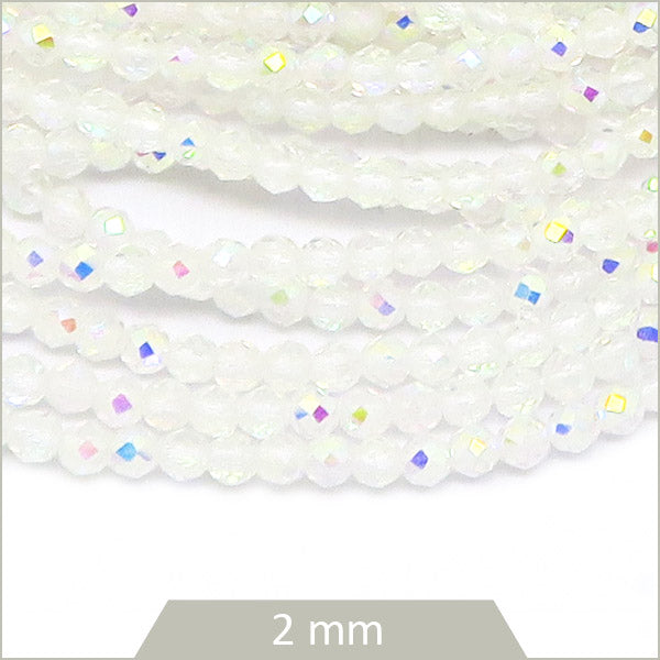 Env. 180 perles de verre à facettes blanche transparentes irisées, 2 mm