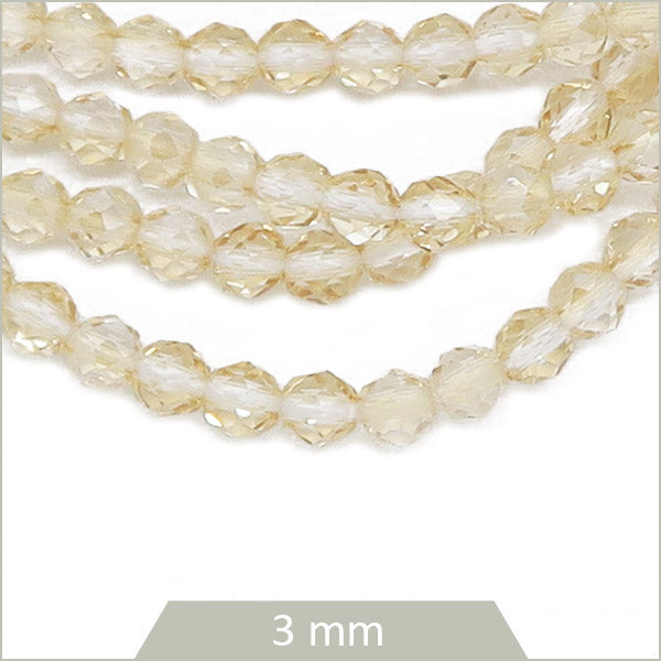 Env. 125 perles de verre à facettes beige transparentes, 3 mm
