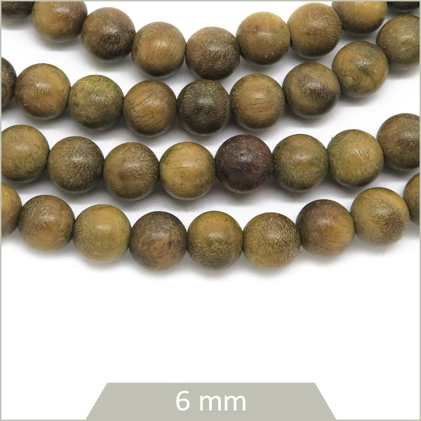 Env. 64 perles rondes en bois de santal, 6 mm