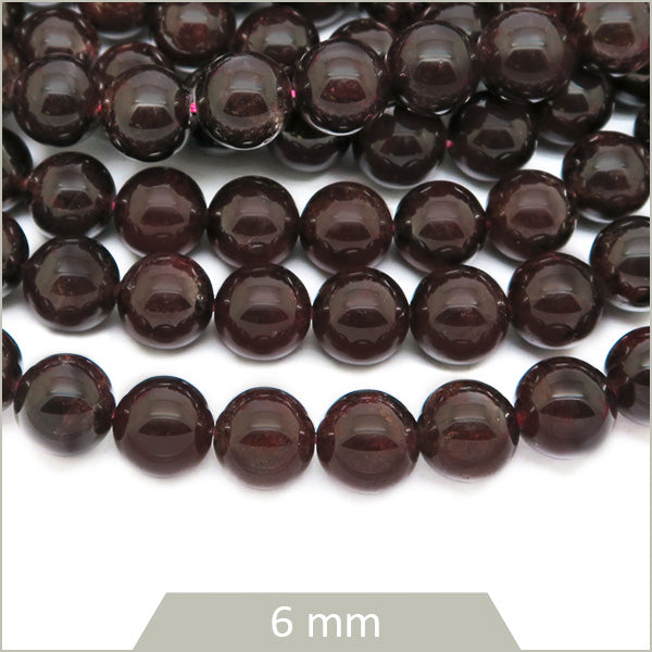 Env. 35 perles rondes en Grenat, 6 mm