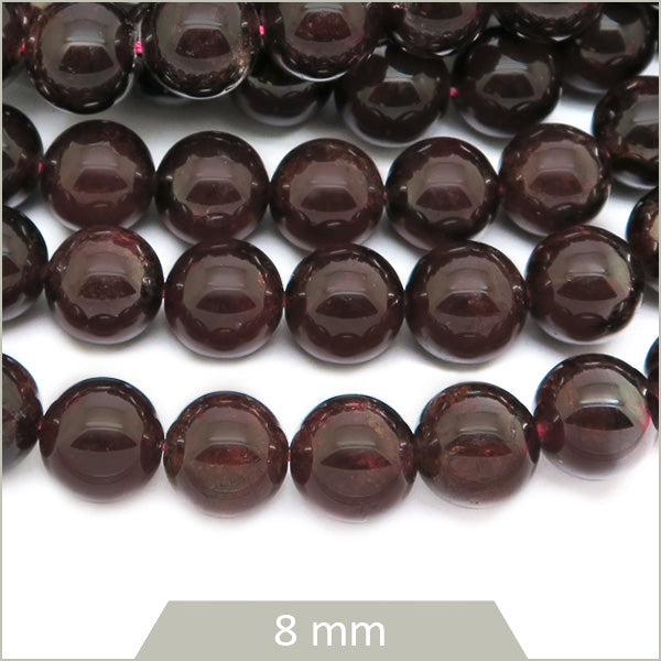 Env. 35 perles rondes en Grenat, 8 mm