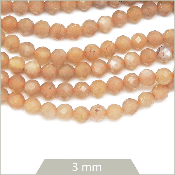 Env. 120 perles facettées en Pierre de soleil, 3 mm