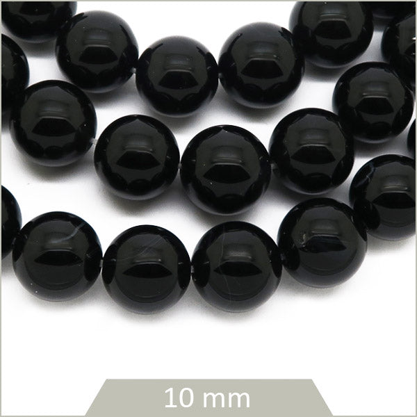 Env. 38 perles rondes d'onyx, 10 mm