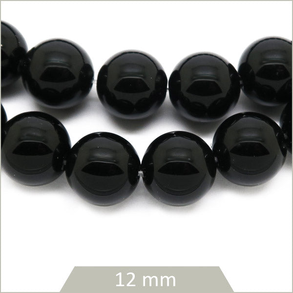 Env. 32 perles rondes d'onyx, 12 mm