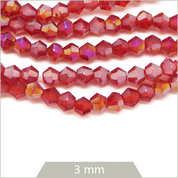 Env. 135 perles de verre toupies rouge irisé, 3 mm