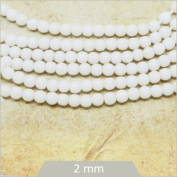 Env. 180 perles de verre rondes blanches, 2 mm