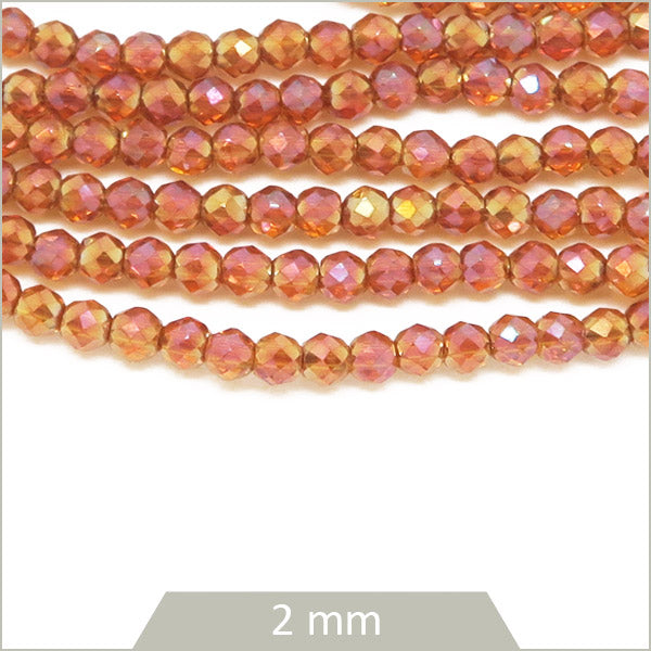 Env. 180 perles de verre rondes à facettes irisé nude, 2 mm