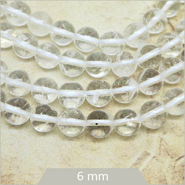 Env. 60 perles rondes en Quartz transparent 6 mm