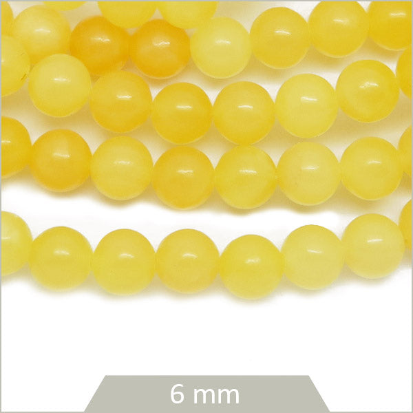 Env. 59 perles rondes en Calcite miel, 6 mm